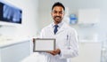 Male dentist with tablet computer at dental clinic Royalty Free Stock Photo