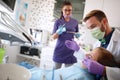 Dentist work on dental clinic with his assistant Royalty Free Stock Photo