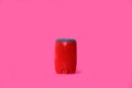 Male deodorant on a bright pink background.