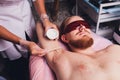Male depilation laser hair removal procedure treatment. Skin preparation process of preparing, applying gel.