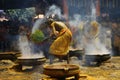 Male devotees perform holy bath ritual with hot turmeric water