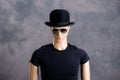 Male display dummy with sunglasses and bowler hat