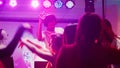 Male DJ partying with people at club Royalty Free Stock Photo