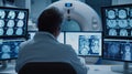 Male doctor analyzes brain scans on multiple screens, ensuring precise diagnostics