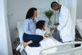 Male doctor attaching pulse oximetry on child patient hand in the ward Royalty Free Stock Photo