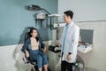 a male doctor and a beautiful patient are in a room at the eye clinic Royalty Free Stock Photo