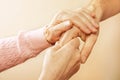 Mature female in elderly care facility gets help from hospital personnel nurse. Close up of aged wrinkled hands of senior woman. G Royalty Free Stock Photo