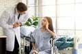 Male doctor checking patient symptom for give consultation to female patient. Royalty Free Stock Photo