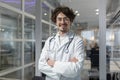 Male Doctor With Crossed Arms and Stethoscope in Medical Office Royalty Free Stock Photo