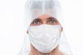 Male doctor epidemiologist wearing respirator mask and safety protective costume during creating vaccine from