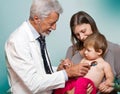 Male doctor examining a child patient Royalty Free Stock Photo