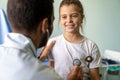 Male doctor examining a child patient in a hospital Royalty Free Stock Photo