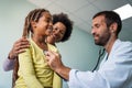 Male doctor examining a child patient in a hospital Royalty Free Stock Photo