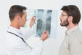 Male doctor explaining spine xray to patient Royalty Free Stock Photo