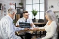 Male doctor explaining x ray results to senior couple Royalty Free Stock Photo