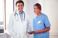 Male doctor and female nurse looking at you Royalty Free Stock Photo