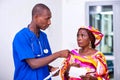 Male doctor giving advice on prescription to a patient woman Royalty Free Stock Photo