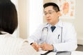 Male doctor giving a consultation to a patient and explaining medical informations and diagnosis in office at clinic