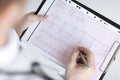 Male doctor hands with cardiogram