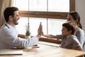 Male doctor have fun greeting with little patient Royalty Free Stock Photo