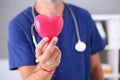 Male doctor hold in arms red heart Royalty Free Stock Photo