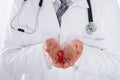 Male Doctor Holding Aids Ribbon