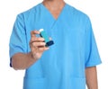 Male doctor holding asthma inhaler on white, closeup. Medical object Royalty Free Stock Photo