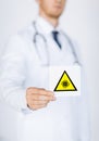 Male doctor holding coronavirus caution sign Royalty Free Stock Photo