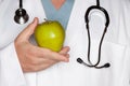 Male Doctor Holding Green Apple Royalty Free Stock Photo