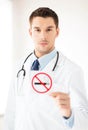 Male doctor holding no smoking sign Royalty Free Stock Photo