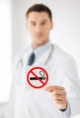 Male doctor holding no smoking sign Royalty Free Stock Photo