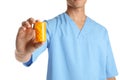 Male doctor holding pill bottle on white, closeup. Medical object Royalty Free Stock Photo