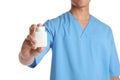 Male doctor holding pill bottle on white background. Medical object Royalty Free Stock Photo