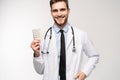 A male Doctor holding pill medical health care pharmacy concept.