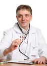 Male doctor holding a pill on white Royalty Free Stock Photo