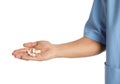 Male doctor holding pills on white background, closeup. Royalty Free Stock Photo