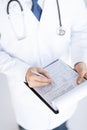 Male doctor holding prescription paper in hand Royalty Free Stock Photo