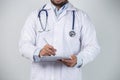 Male doctor using his digital tablet in the hospital. Royalty Free Stock Photo