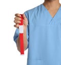 Male doctor holding tourniquet on white, closeup. Medical object Royalty Free Stock Photo