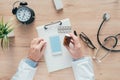 Male doctor holding unlabeled bottle of various pills and medication Royalty Free Stock Photo