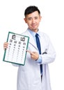 Male doctor keeping optometry chart