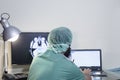 Male doctor listening to patient during telemedicine session. Man doctor having online consultation on laptop holding x Royalty Free Stock Photo