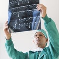 Male doctor looking at x-rays Royalty Free Stock Photo