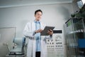 a male doctor maintains an eye checklist that forms the basis of examinations Royalty Free Stock Photo