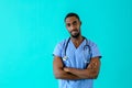 Male doctor or nurse wearing blue scrubs uniform and stethoscope Royalty Free Stock Photo