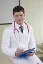 Male doctor with paperwork Royalty Free Stock Photo