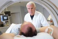 male doctor and patient tomographic scanner in hospital Royalty Free Stock Photo