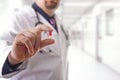 Male doctor with pill Royalty Free Stock Photo