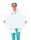 Male doctor posing with white blank billboard Royalty Free Stock Photo