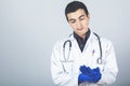 Male doctor putting blue latex medical gloves Royalty Free Stock Photo